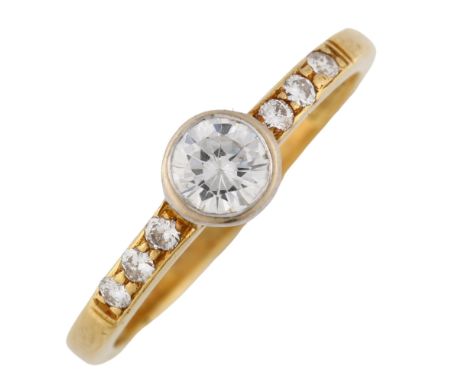 An 18ct gold 0.3ct solitaire diamond ring, set with modern round brilliant-cut diamonds and diamond set shoulders, colour app