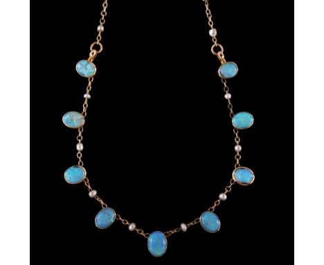 An Edwardian 9ct gold opal and pearl fringe necklace, set with oval cabochon white opals, with seed pearl spacers and 9ct fin