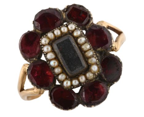 A large Georgian garnet and pearl cluster memorial ring, unmarked gold closed-back settings with central vacant memorial pane