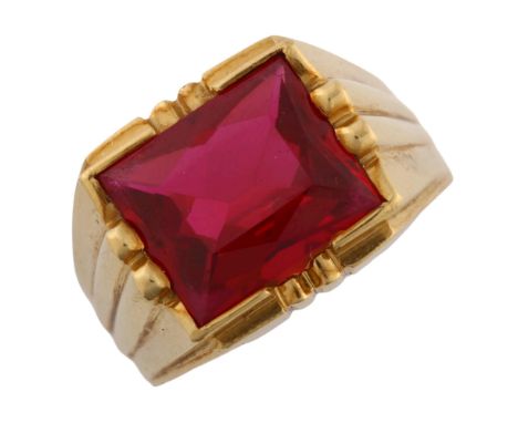 A heavy Continental synthetic ruby signet ring, unmarked high carat gold settings, setting height 13.6mm, size R, 12.4gNo dam