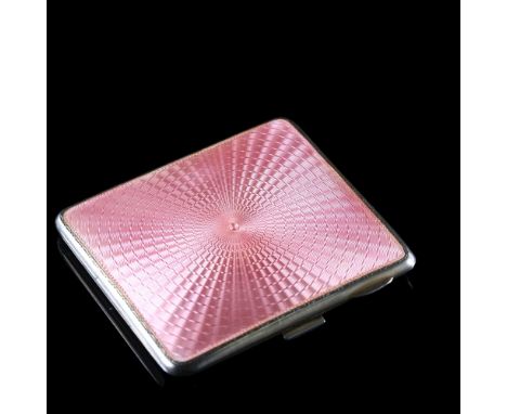 An Art Deco George V silver and pink enamel cigarette case, rectangular form with engine turned decoration and gilt interior,