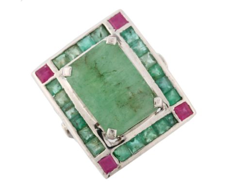 A large emerald and ruby cluster cocktail ring, unmarked white metal settings with openwork bridge, setting height 26.2mm, si