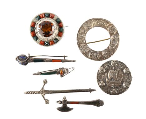 Various Scottish and Celtic silver brooches, including hardstone sword example, largest length 77mm, 68.6g total (7)Axe is la