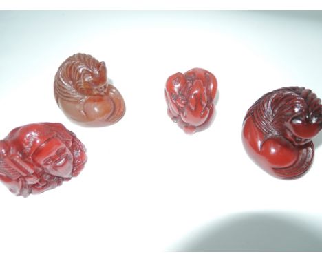 Four signed and carved resin netsuke two curled cats, rabbits and man  