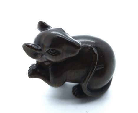 A signed carved wooden Japanese netsuke of a large rat