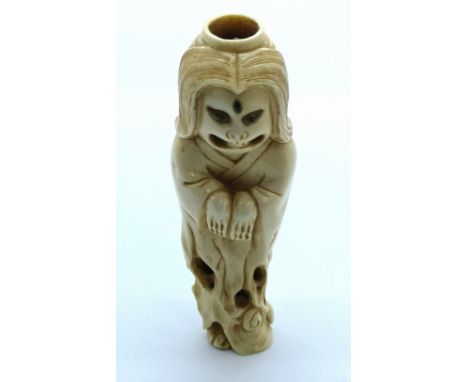 A signed carved ivory Japanese netsuke ghost candle holder 