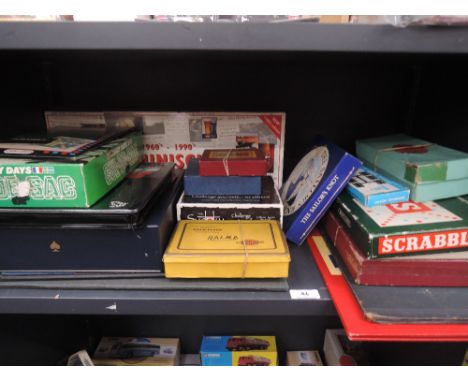 A shelf of vintage board games including Touring Scotland, Millionaire, Chase, Royale etc, all appear complete