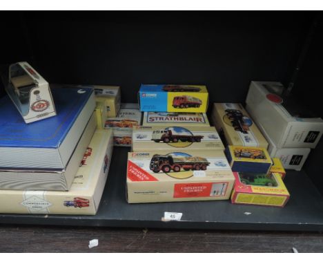 A shelf of Corgi (china) EFE and Matchbox Models of Yesteryear diecasts including Buses, Adverting wagons etc, all boxed, app