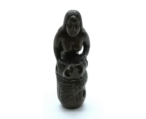 A carved and signed Japanese netsuke of a mermaid