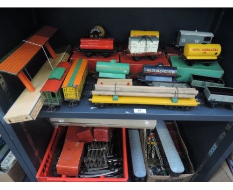 Two shelves of Hornby and similar 0 gauge including rolling stock, signals, Trent Platform, track, etc, some items with origi