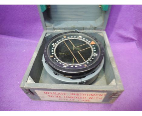 A World War II R.A.F. PIU compass, in wooden travel box, in good condition