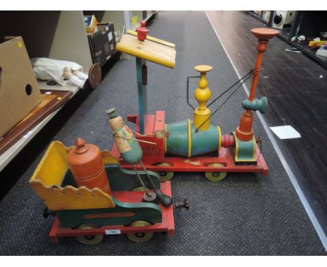 A Tri-ang wooden pull along train, with lithograph makers name and title, Nellie,  Far Tottering &amp; Oyster Creek Rly, desi