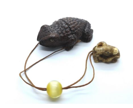 A carved and signed Japanese Inro of a toad with ojime bead and ivory carved buffalo netsuke