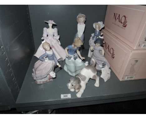 Five Lladro, Nao and Coalport figurines including Girls with Umbrella's, Girls with Puppies and Barbara Anne along with a Lla