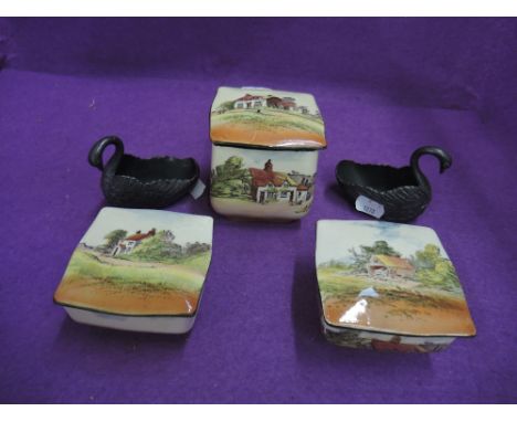 Three Royal Doulton series ware lidded trinket boxes and two pewter swans