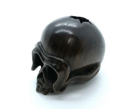 A signed carved wooden Japanese netsuke a broken skull