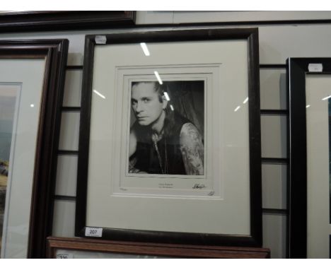 A framed Studio Limited Editions print after John Stoddart, Ozzy Osborne, bearing signatures 185/2500, with certificate