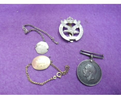 A World War I 1914-18 medal to 4964 Pte S Moss R.W.Fus, two I.D. Bracelets, M Bate 12932 V.A.D., M Smith LECB 18/2 plus a Pil