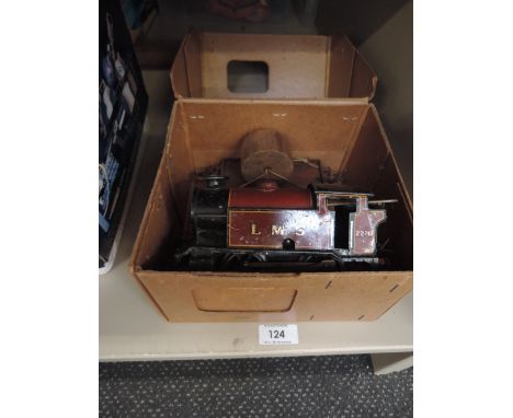 A Hornby 0 gauge clockwork 0-4-0 LMS tank engine and two items of rolling stockCONDITION REPORTClockwork motor winds up and r