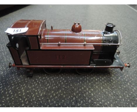 A Carette for Bassett Lowke electric gauge 1 0-4-0 tank engine in maroon and black livery numbered 112