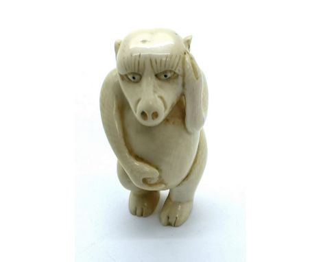 A signed carved ivory Japanese netsuke of demon