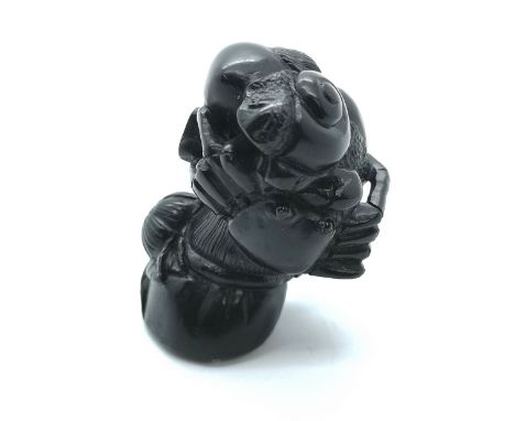 A signed carved Japanese netsuke with crab and sea snail