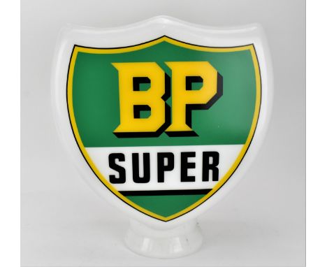 A 'BP Super' shield-shaped glass petrol pump, with design and lettering in yellow, green and black, 48cm high x 41 cm wide 