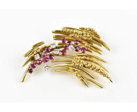 An 18ct yellow gold, diamond and ruby brooch, in the Modernist taste, set with five brilliant cut diamonds and fourteen rubie