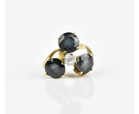 A yellow metal, diamond and teal sapphire dress ring, with central old cut diamond in a trilogy surround of round-cut sapphir