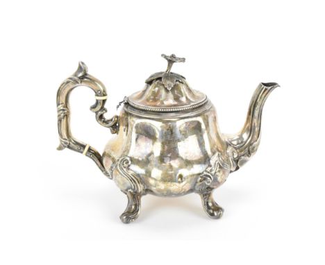 A 19th century French silver teapot by Martial Fray, Paris, circa 1850s, with floral finial to the lid, acanthus detail to ha