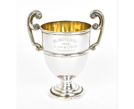 An Edwardian Continental silver horse racing trophy cup, stamped 'Silver', the front inscribed 'Bangalore 1908 - Ladies' Hack