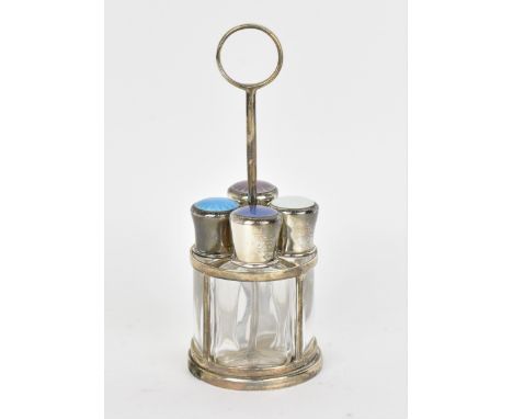 An early 20th silver and enamel four-section scent bottle stand, each triform perfume flask with engine turned cover decorate