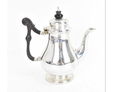 A George V silver bachelor's coffee pot by Thomas Bradbury &amp; Sons Ltd, London 1911, of baluster form with domed lid, moun