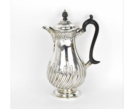 A late Victorian silver coffee pot by James Deakin &amp; Sons, Chester 1887, with part twist fluted body, ebonised turned han