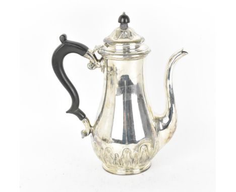 A George V silver coffee pot by Sibray, Hall &amp; Co Ltd, Sheffield 1920, of baluster form with leaf tip cast to the bulbous