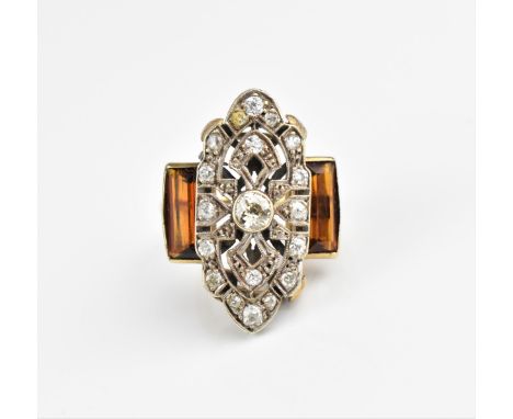 An Art Deco white, yellow metal and diamond dress ring, designed with pierced plaque centred by a bezel set old mine cut diam