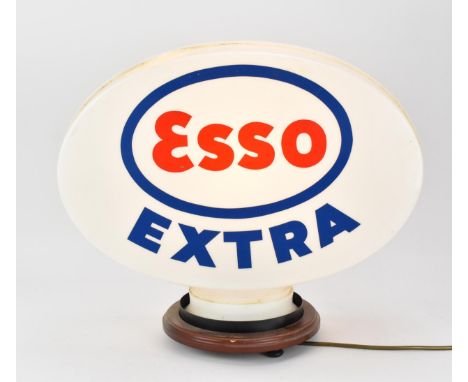 An Esso Extra plastic petrol pump globe, with light fixture, 41 cm high with base, 47 cm wide 