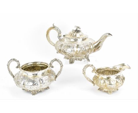 A William IV silver three piece tea set by William Hunter II, London 1833, comprising a teapot, twin-handled sugar bowl and m