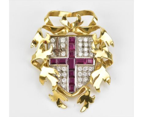 An 18ct yellow gold, diamond and ruby heraldic brooch, with channel set rubies in a St George's cross, the white ground with 
