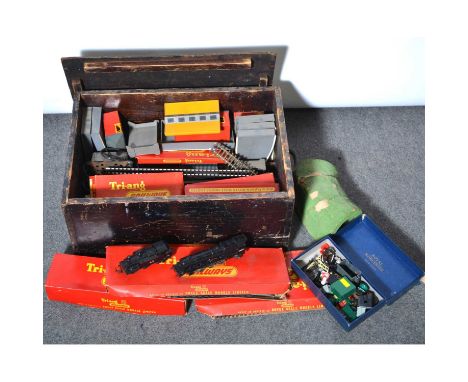 Tri-ang OO gauge model railways, a small collection in wooden crate, including one locomotive, track, buildings, wagons and o