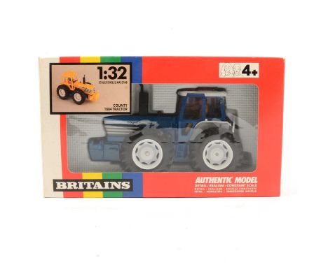 Britains Farm toy, ref 9521 county 1884 tractor, blue body, boxed.