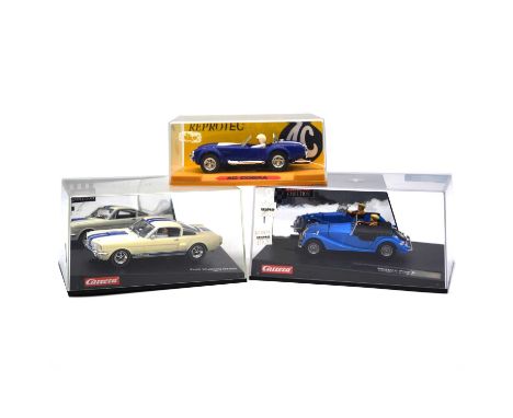 Carrera and ReproTec slot car racing, three cars including ReprocTec AC Cobra; Carrera Morgan Plus 8, Centenary edition; Ford