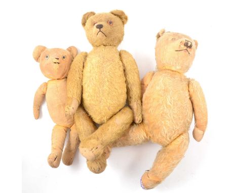 Early 20th and mid-century teddy bears; including jointed Merrythought, two other straw-filled bears; two dog toys and a Pelh