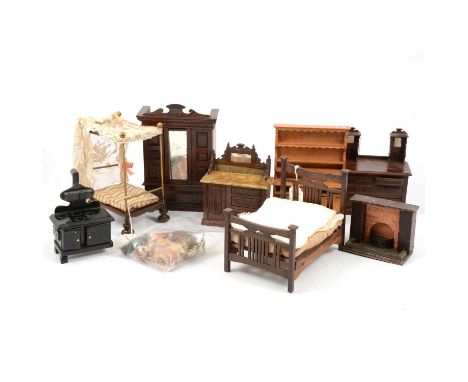 A collection of Victorian and later dolls house furniture, including dressers cooking range, bed with lace top; ceramic acces