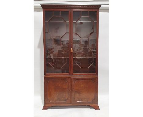 19th century mahogany bookcase, the moulded cornice above the astragal glazed doors enclosing adjustable shelves, two cupboar