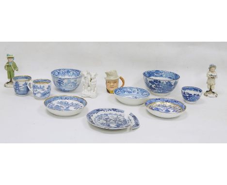 Blue and white transfer-decorated ceramics to include teacups, saucers, semi-china sugar bowl and two porcelain figures of ch