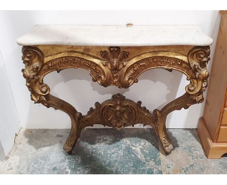 Victorian giltwood console table in the 18th century style,  white serpentine marbled top on elaborate C-scroll and shell bas