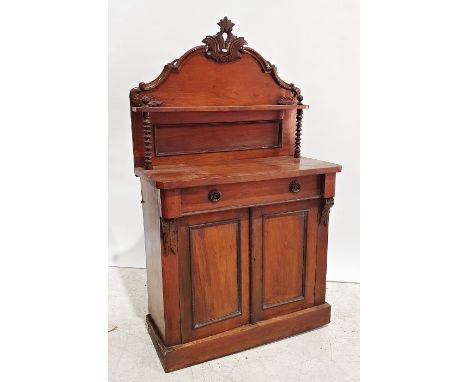 Early 20th century walnut sideboard, the carved back with single narrow shelf, on turned front supports above the rectangular