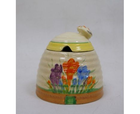 Clarice Cliff pottery ‘Spring Crocus’ honeypot and coverCondition ReportCrazing throughout. Wear and tape/ sticker residue to