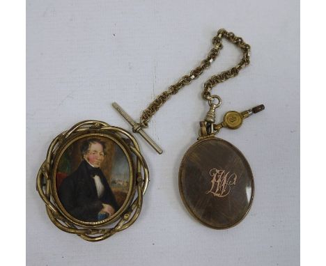 Victorian gilt metal brooch set with a half-length miniature portrait of a gentleman with book within a twisted wire frame, 6